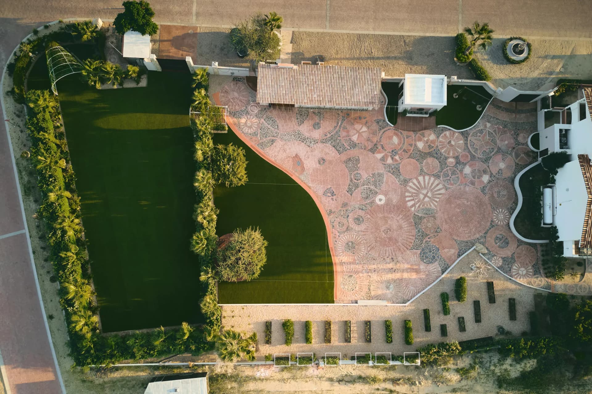 Petunia’s Venue — lawn, mosaic terrace and pavilion seen from above